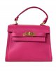 Mini citybag piel detalle metálico fucsia